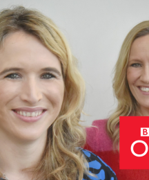 Two women looking at the camera and smiling, with the BBC logo in the bottom right