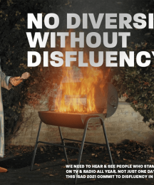 A man standing next to a barbecue that has flames coming out of it.