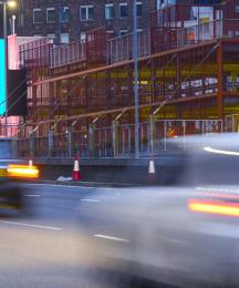 A busy road with an outdoor advertisement displaying the I Stammer campaign