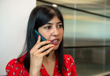 A woman speaking into a mobile phone
