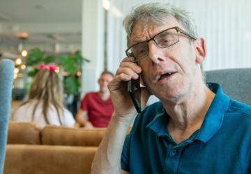 A man speaking into a telephone