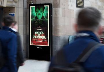 Photo of our Calls Of Terror movie poster on a JCDecaux street wall digital screen