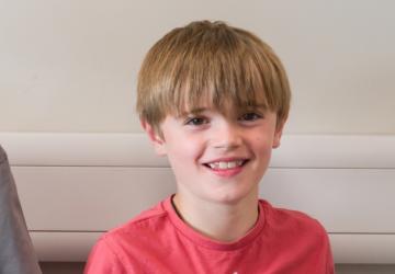 A young boy smiling