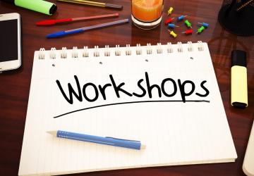 A writing pad with the word 'Workshop' on it