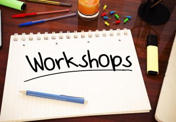 A writing pad with the word 'Workshop' on it