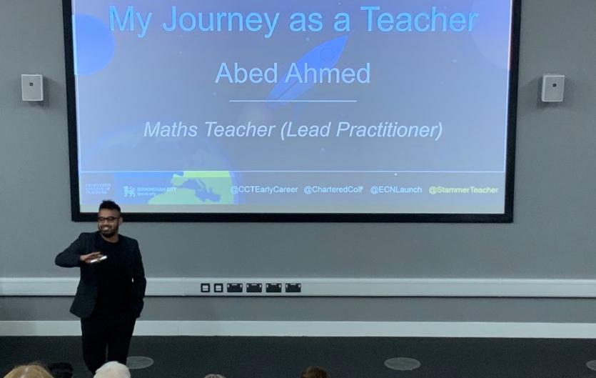 Abed Ahmed, teacher and stammering advocate, speaking in front of a whiteboard