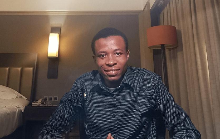 Keeping the light of perseverance on A man looking at the camera