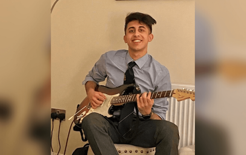Continue speaking, even if you stammer The article's author, Aman Khan, sitting and playing the guitar