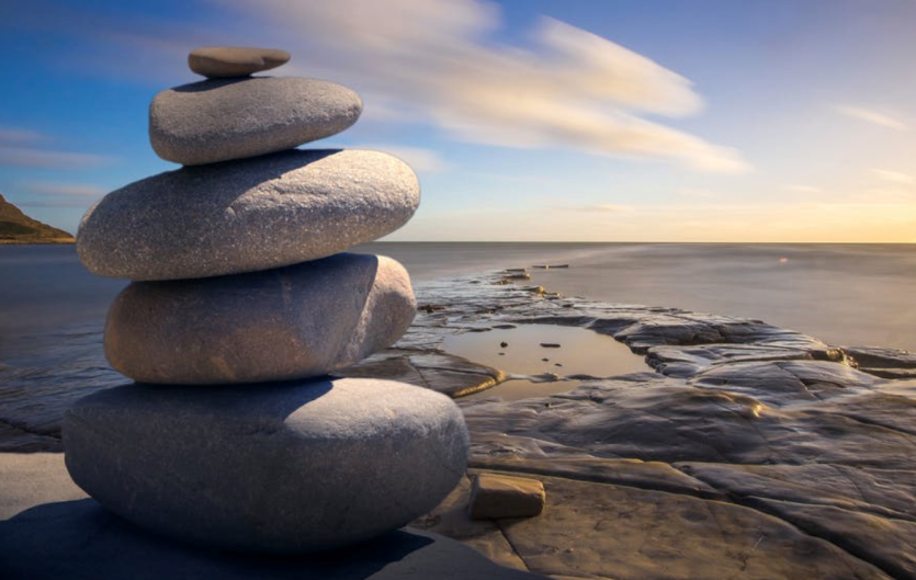 Mindfulness for people who stammer A pile of stones on a beach