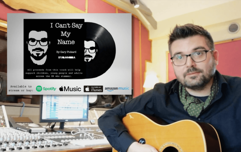 Why I wrote the song 'I Can't Say My Name' A man holding a guitar in a music studio
