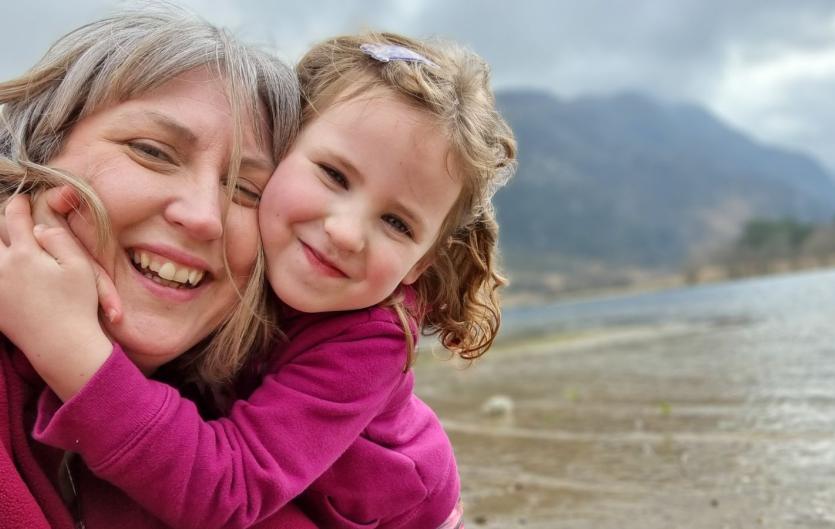 A year on, I cannot believe how far we have come A mother and daughter looking at the camera and smiling