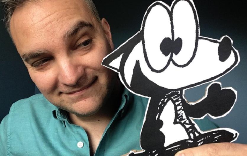 The story behind the comic Daniele Rossi holding a cutout of his character Franki Banki, a fox.