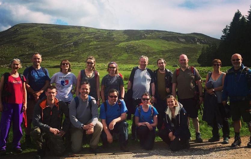 Events A group of fifteen people at an country walk.