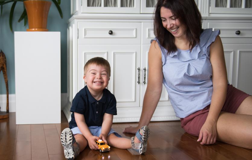 Variations and complications Mother playing with a child who has Downs Syndrome
