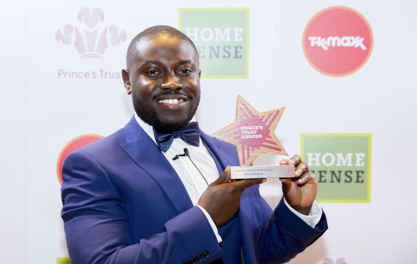 Something needed to give The author in a suit and bow-tie, holding a star-shaped Prince's Trust award trophy