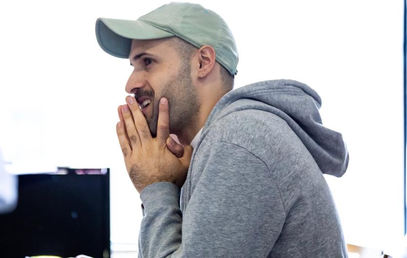 Is it the end of the world? James Corley in profile, in cap and hoodie, chin resting on hands