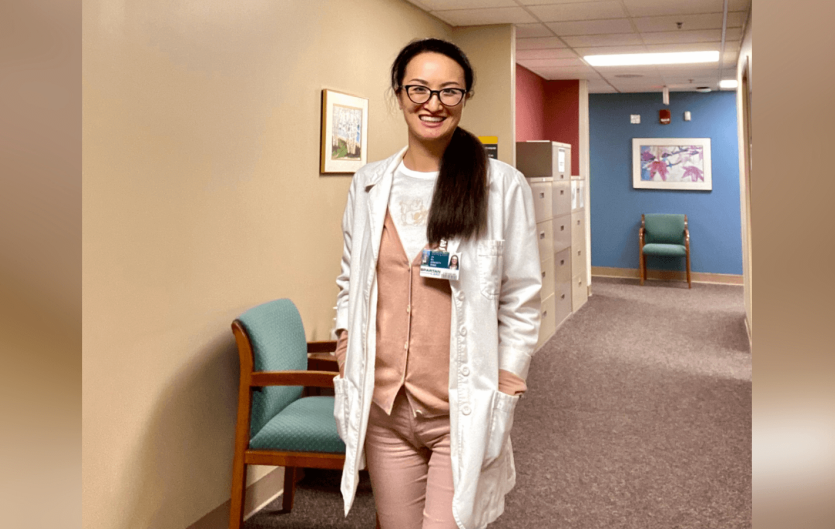 Stammering is the superpower to connect with people A lady in a medical outfit looking at the camera