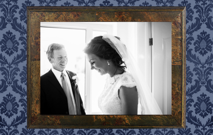 All around me was the chant 'Speech, speech, speech!' A picture of a bride and the father of the bride in a frame hanging on a wall
