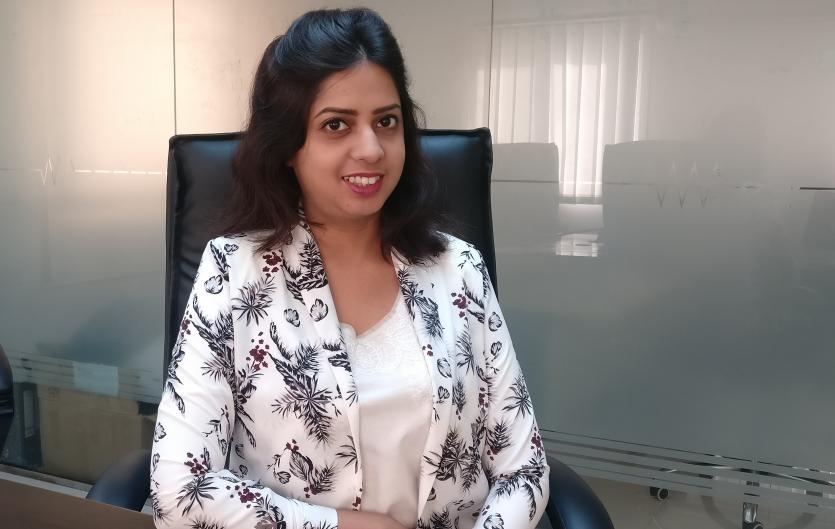 Stammering gives me an edge Nabiha Khan sitting at a desk