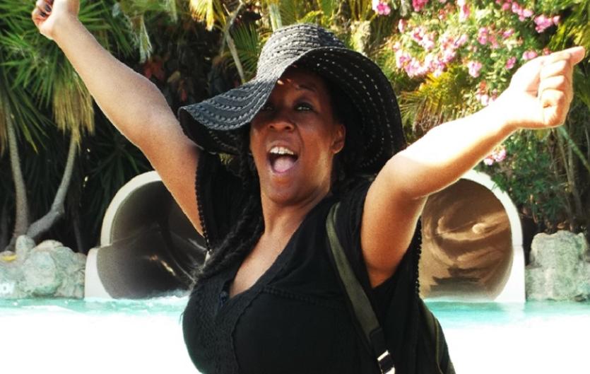 Black History Month, Stammering & Identities The article's author, Rebekah, with her hands in the air