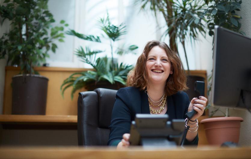 Reasonable adjustments Betony Kelly, Trustee & Lead for Civil Service Stammering Network, sitting at a work desk