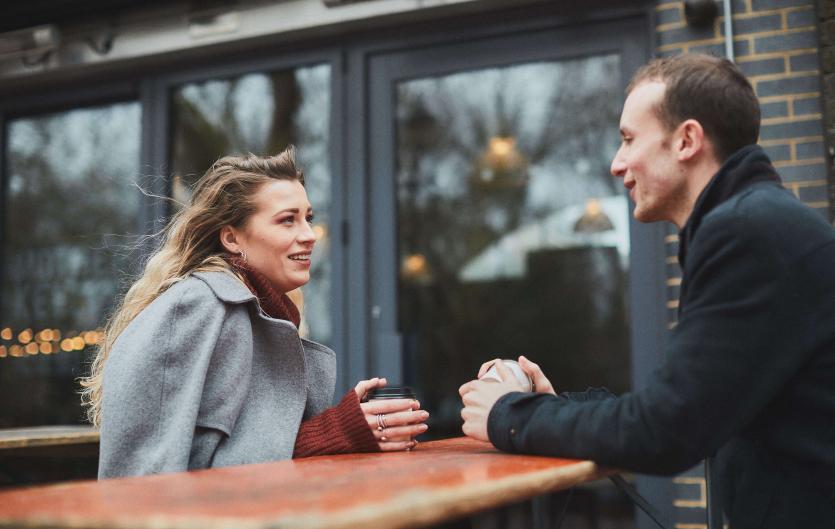About Stammering A man and woman chatting over a coffee