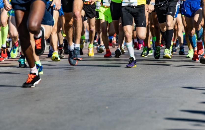The legs of people running at a marathon