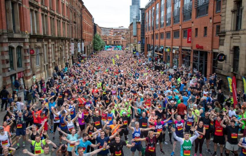 Great Manchester Run 2023 (10k) A group of people doing a sponsored run