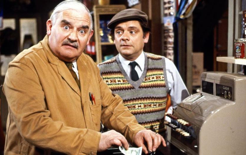An image from the sitcom Open All Hours, featuring two men, one looking at the camera and the other man looking at him