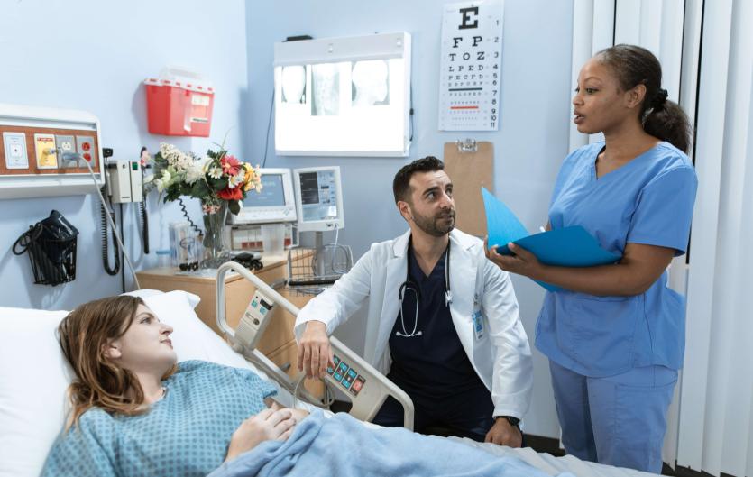Job-based oral exam guide if you stammer A nurse and a doctor beside a patient in a hospital setting