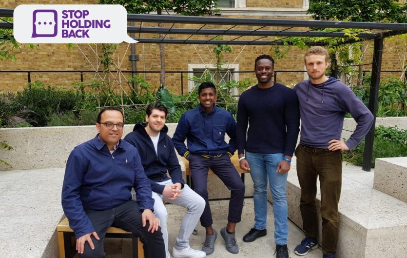 Five men smiling at the camera - captioned with 'Stop Holding Back' logo.