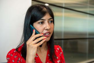 A woman speaking into a mobile phone