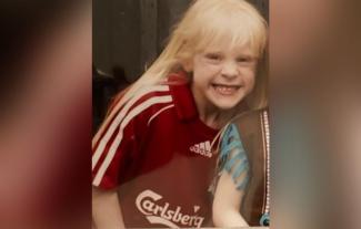 A girl in a football shirt