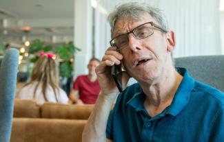 A man speaking into a telephone