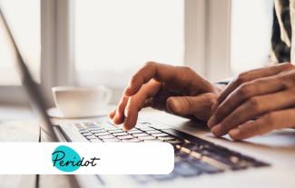 A person's hands typing on a laptop computer. There is an inset of a logo saying the word 'Peridot'