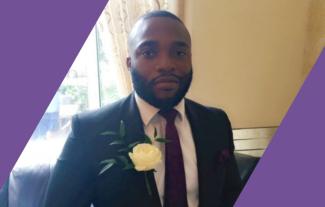 A man in a wedding suit smiling