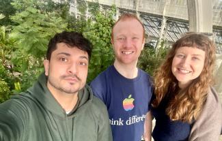 Three people smiling for the camera