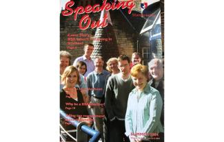 A magazine cover showing a group of people smiling