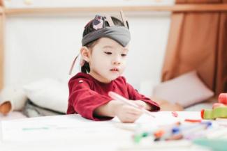 A young girl drawing