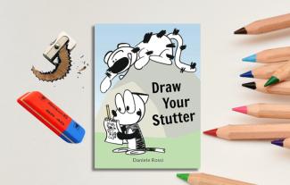 A book cover, surrounded by colouring pencils, a pencil sharpener and an eraser