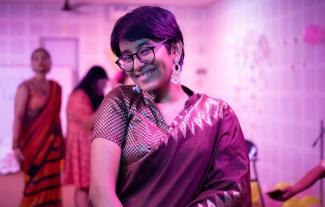 A woman in traditional Indian dress, smiling