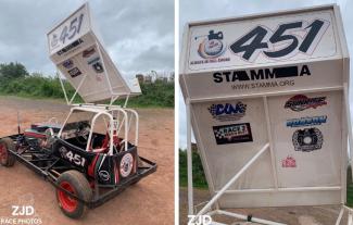 A stock car with a logo saying STAMMA