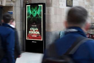 Photo of our Calls Of Terror movie poster on a JCDecaux street wall digital screen