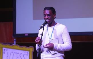 A man speaking into a microphone