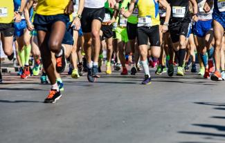 Legs of a group of people on a sponsored run