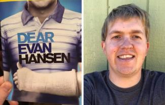 A man smiling, with a brochure showing a man with an arm in a sling, with the words 'Dear Evan Hansen' on top