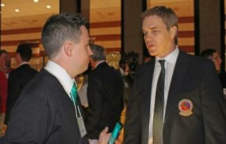 A man interviewing another man