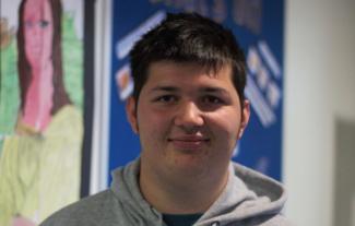 A young man smiling