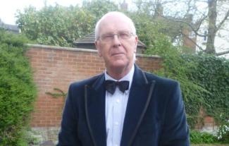 A man wearing a dinner jacket and bow tie