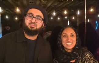 A man and a woman smiling